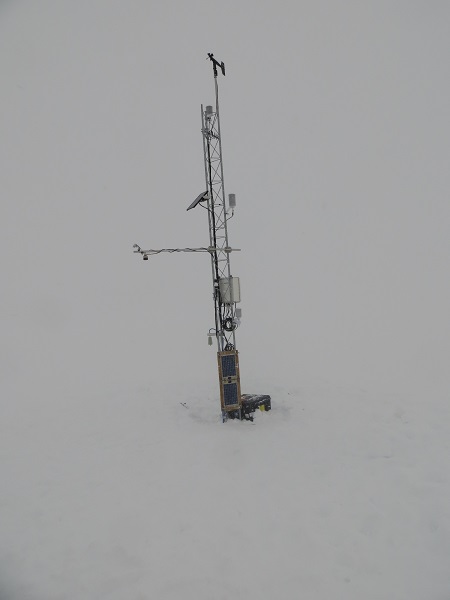The completed Windless Bight AWS. At this point, I just wanted to take this quick picture and get out of there so we could make it back to town.  The best indication of the weather in this picture is the fact that you can't make out the horizon at all.